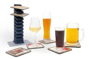 A beer glass with liquid, used as a serving utensil for alcoholic drinks and ingredients in a bar.