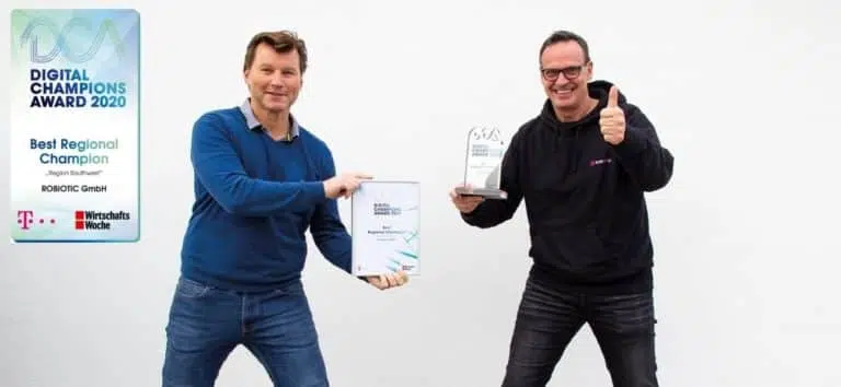 Robiotic managing directors hold the award in their hands